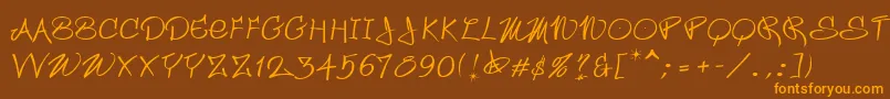 フォントWildstyle – オレンジ色の文字が茶色の背景にあります。