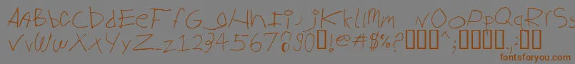 フォントBiglog ffy – 茶色の文字が灰色の背景にあります。