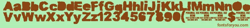 Fonte MuddytractorsoliddemoKcfonts – fontes marrons em um fundo verde