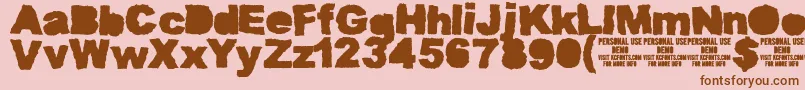 Fonte MuddytractorsoliddemoKcfonts – fontes marrons em um fundo rosa