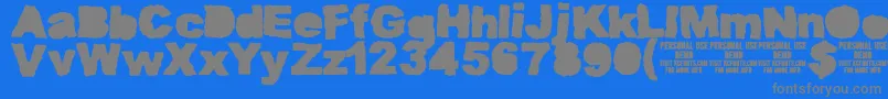 MuddytractorsoliddemoKcfonts Font – Gray Fonts on Blue Background