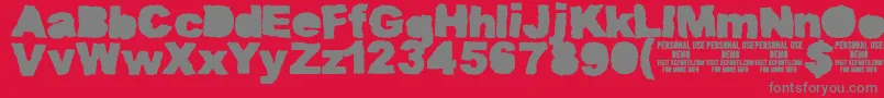 fuente MuddytractorsoliddemoKcfonts – Fuentes Grises Sobre Fondo Rojo