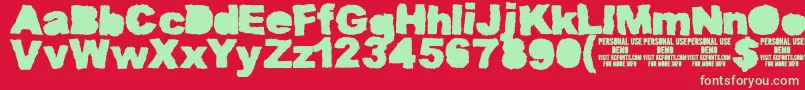 MuddytractorsoliddemoKcfonts Font – Green Fonts on Red Background