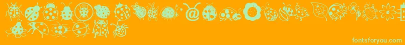 Czcionka LadybugDings – zielone czcionki na pomarańczowym tle