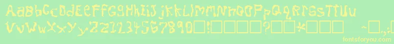 フォントDissonantFractured – 黄色の文字が緑の背景にあります