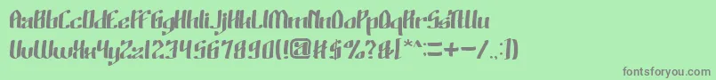 フォントWinoSutarminKadir – 緑の背景に灰色の文字