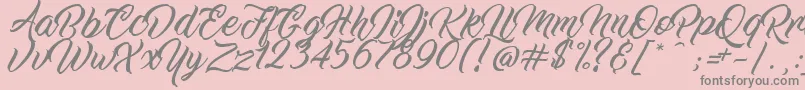 WorkInProgress-fontti – harmaat kirjasimet vaaleanpunaisella taustalla