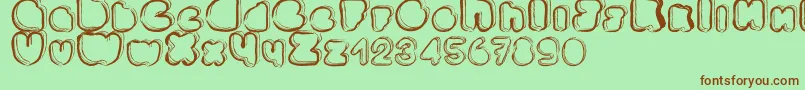 Ponctuation-fontti – ruskeat fontit vihreällä taustalla