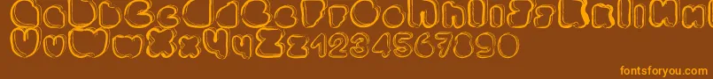 フォントPonctuation – オレンジ色の文字が茶色の背景にあります。