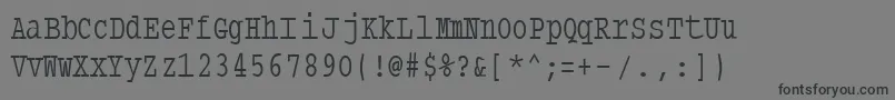 フォントTypewritercondensed – 黒い文字の灰色の背景