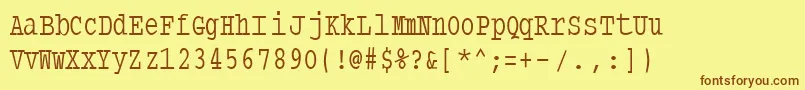 Typewritercondensed-Schriftart – Braune Schriften auf gelbem Hintergrund