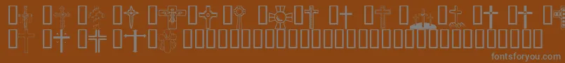 Wmcrosses1-Schriftart – Graue Schriften auf braunem Hintergrund