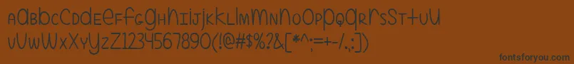 ALittleMixedUp Font – Black Fonts on Brown Background
