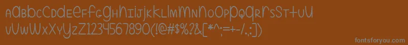 ALittleMixedUp Font – Gray Fonts on Brown Background