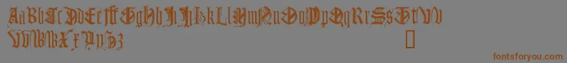 Więcej informacji o czcionce MonumentalGothicDemo Czcionka MonumentalGothicDemo – brązowe czcionki na szarym tle