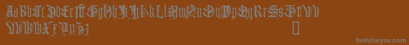 フォントMonumentalGothicDemo – 茶色の背景に灰色の文字