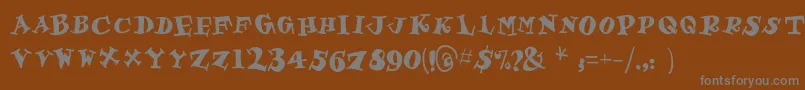 フォントGastronom – 茶色の背景に灰色の文字