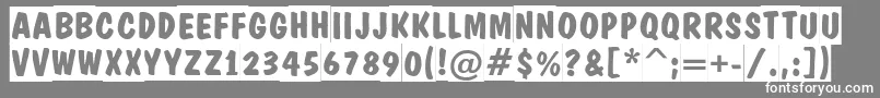 フォントADominotitulslBold – 灰色の背景に白い文字