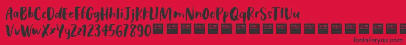 Police CosmicRaysDemo – polices noires sur fond rouge