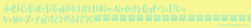 CosmicRaysDemo-Schriftart – Grüne Schriften auf gelbem Hintergrund