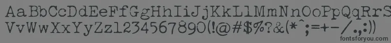 LuckyTypewriter Font – Black Fonts on Gray Background