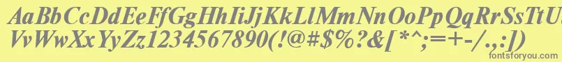 TimesdlBoldItalic-fontti – harmaat kirjasimet keltaisella taustalla