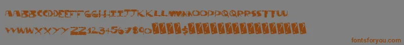 フォントThriftstore – 茶色の文字が灰色の背景にあります。