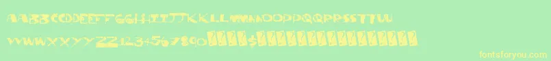 フォントThriftstore – 黄色の文字が緑の背景にあります