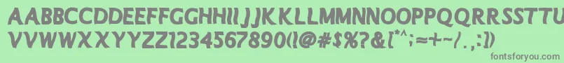 Manolete Font – Gray Fonts on Green Background