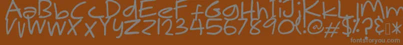Czcionka MakNgahPunya – szare czcionki na brązowym tle