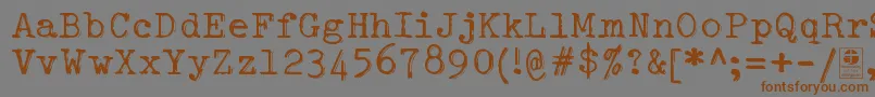 Шрифт TypowriterShakyDemo – коричневые шрифты на сером фоне