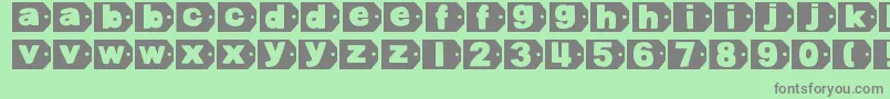 DjbTaggedAgain-Schriftart – Graue Schriften auf grünem Hintergrund