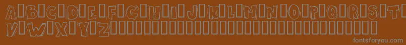 Skrotfon-fontti – harmaat kirjasimet ruskealla taustalla