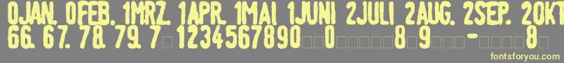 LinotypeTagesstempelFett Font – Yellow Fonts on Gray Background