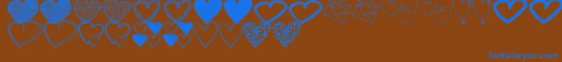 Czcionka HeartsShapessTfb – niebieskie czcionki na brązowym tle