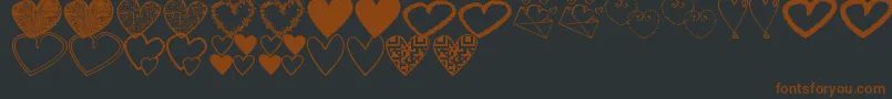 Шрифт HeartsShapessTfb – коричневые шрифты на чёрном фоне