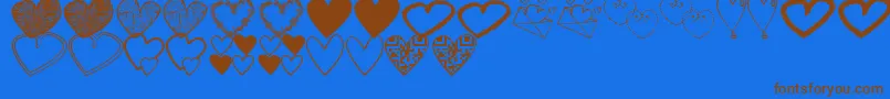 HeartsShapessTfb-fontti – ruskeat fontit sinisellä taustalla
