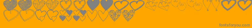 フォントHeartsShapessTfb – オレンジの背景に灰色の文字