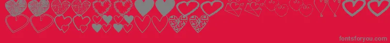Fonte HeartsShapessTfb – fontes cinzas em um fundo vermelho