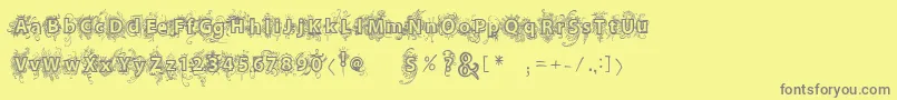 Vtksdejavu-fontti – harmaat kirjasimet keltaisella taustalla