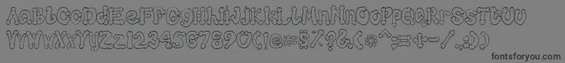 Cocksure Font – Black Fonts on Gray Background