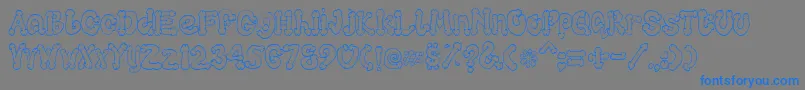 Cocksure-Schriftart – Blaue Schriften auf grauem Hintergrund