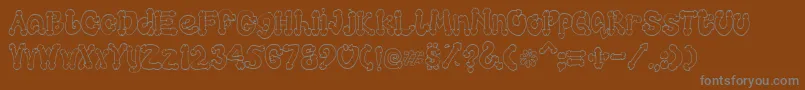 Cocksure Font – Gray Fonts on Brown Background