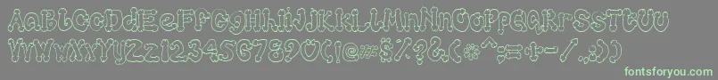 Cocksure Font – Green Fonts on Gray Background