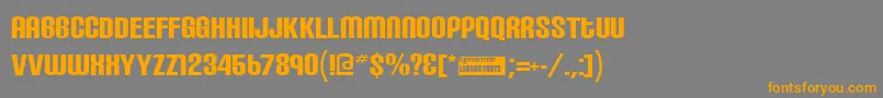 フォントCarbonblock – オレンジの文字は灰色の背景にあります。