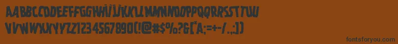 Czcionka Ghoulishintentstag – czarne czcionki na brązowym tle