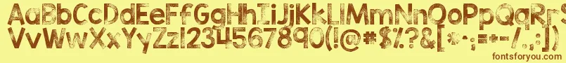 Kgtribecastamp Font – Brown Fonts on Yellow Background