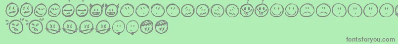 Fonte Sketchysmiley – fontes cinzas em um fundo verde