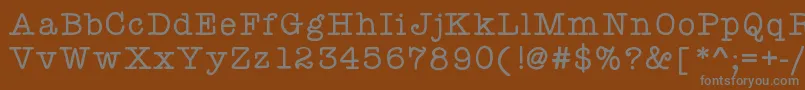 フォントKbyourejustmytype – 茶色の背景に灰色の文字