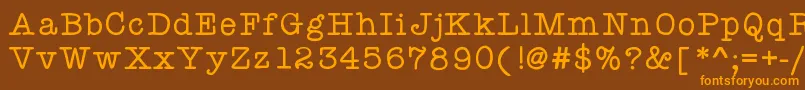 フォントKbyourejustmytype – オレンジ色の文字が茶色の背景にあります。